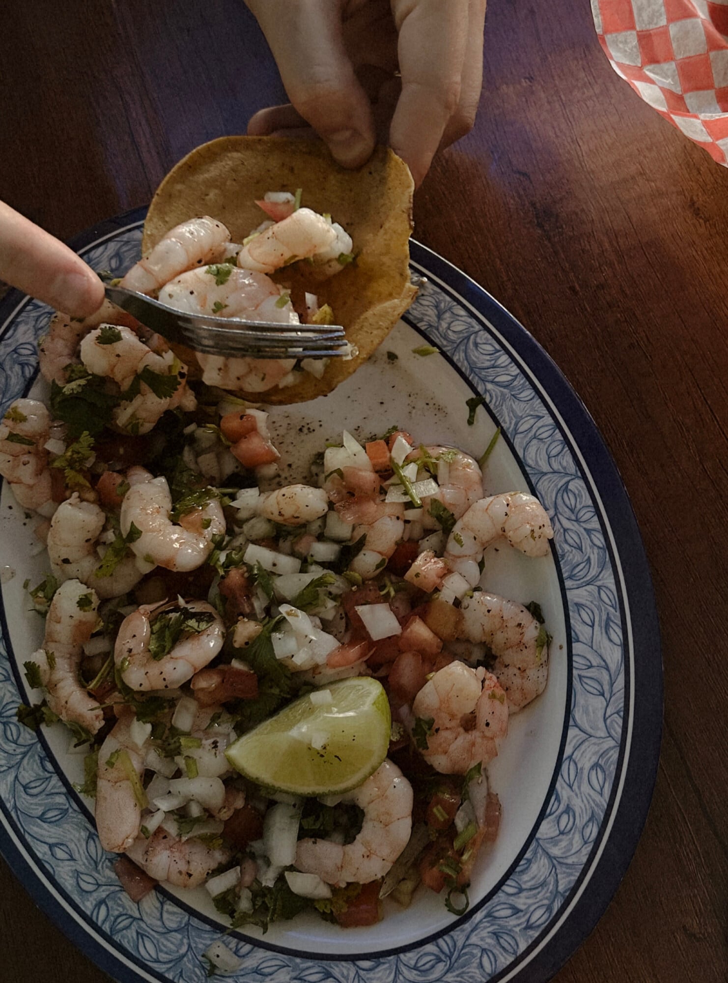 El Marlin Azul, Mexico — Ceviche tostada with grilled shrimp, diced tomato, cilantro, lime, and black pepper served on decorative ceramic plate