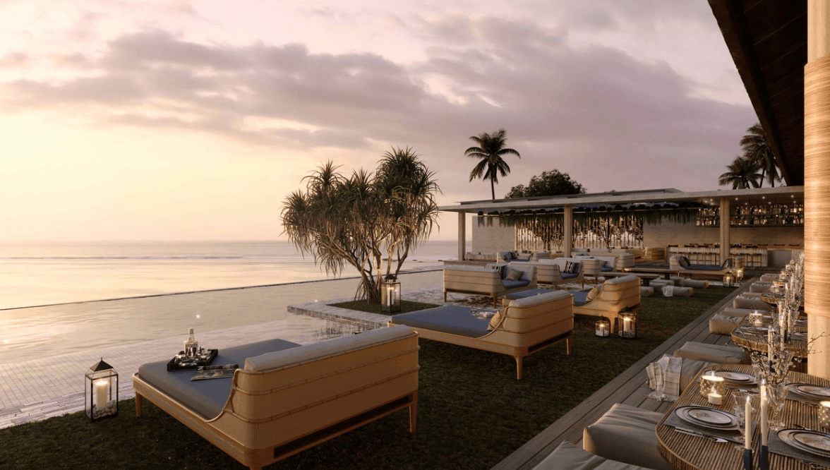 Explorer’s Beach Club — Explorer's Beach Club, Asia — Sunset terrace with teak loungers, infinity pool, palm trees, and open-air dining pavilion overlooking calm coastal waters.
