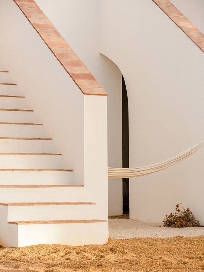 Architectural photo of stairs and hammock at Casa Modesta. Captured by Ash James
