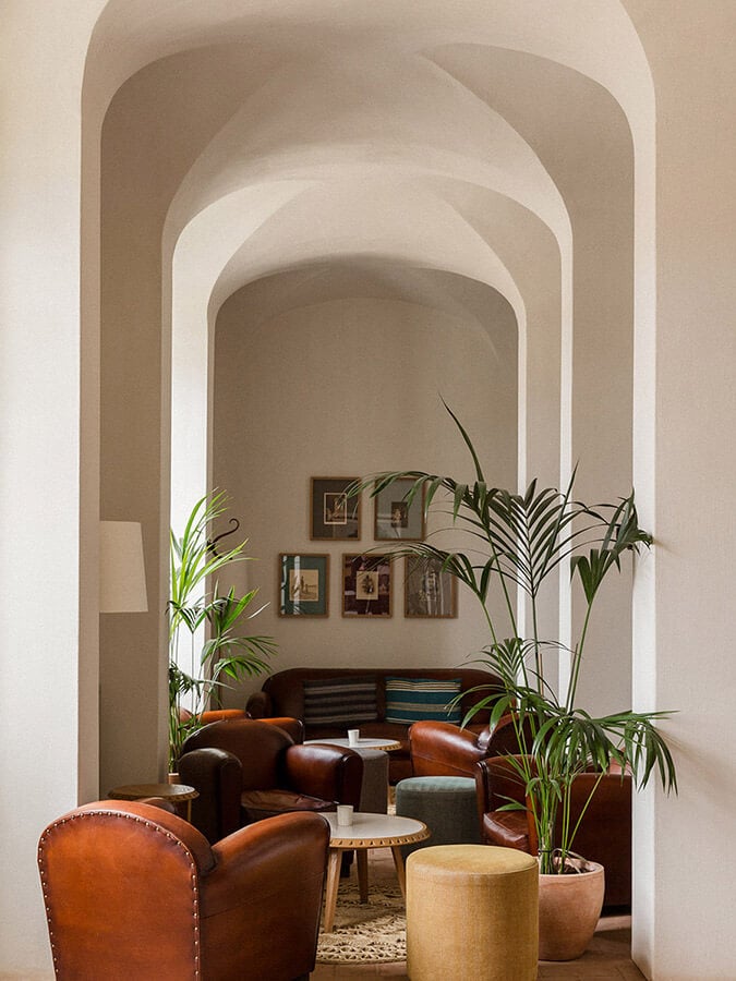 Seating area with leather chairs at Sao Lourenco Do Barrocal Hotel in Portugal