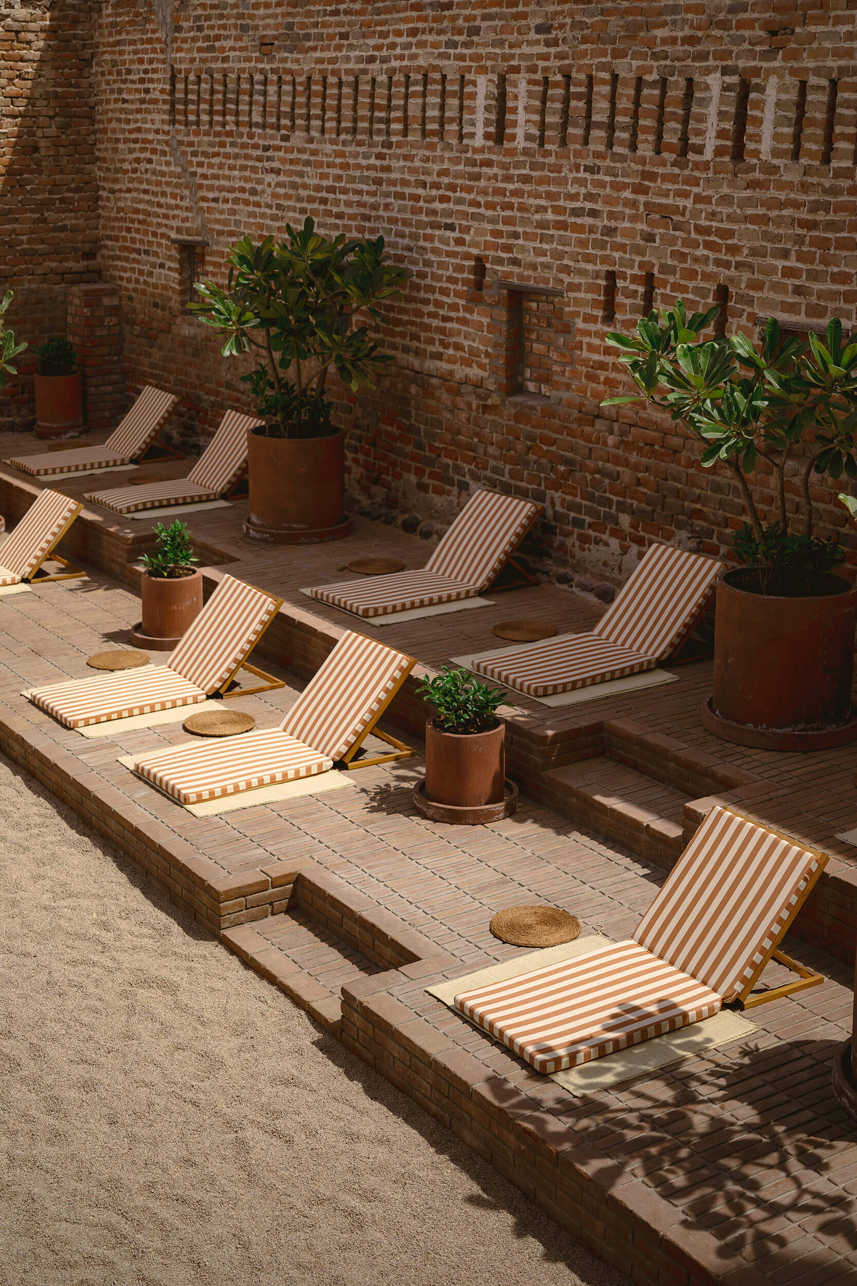 Orange striped pool loungers at Baja Club Hotel, La Paz, Mexico. Grupo Habita