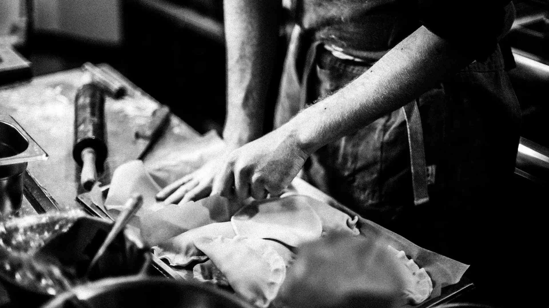 Cooking Class, Greece — Chef hands preparing fresh ingredients on wooden surface, artisanal culinary instruction in warm natural light.
