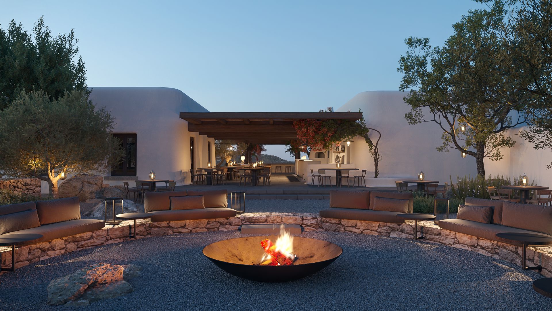 Aloni Sunset Lounge, Europe — Minimalist courtyard with central fire bowl, stone seating, olive trees, and whitewashed architecture at dusk.