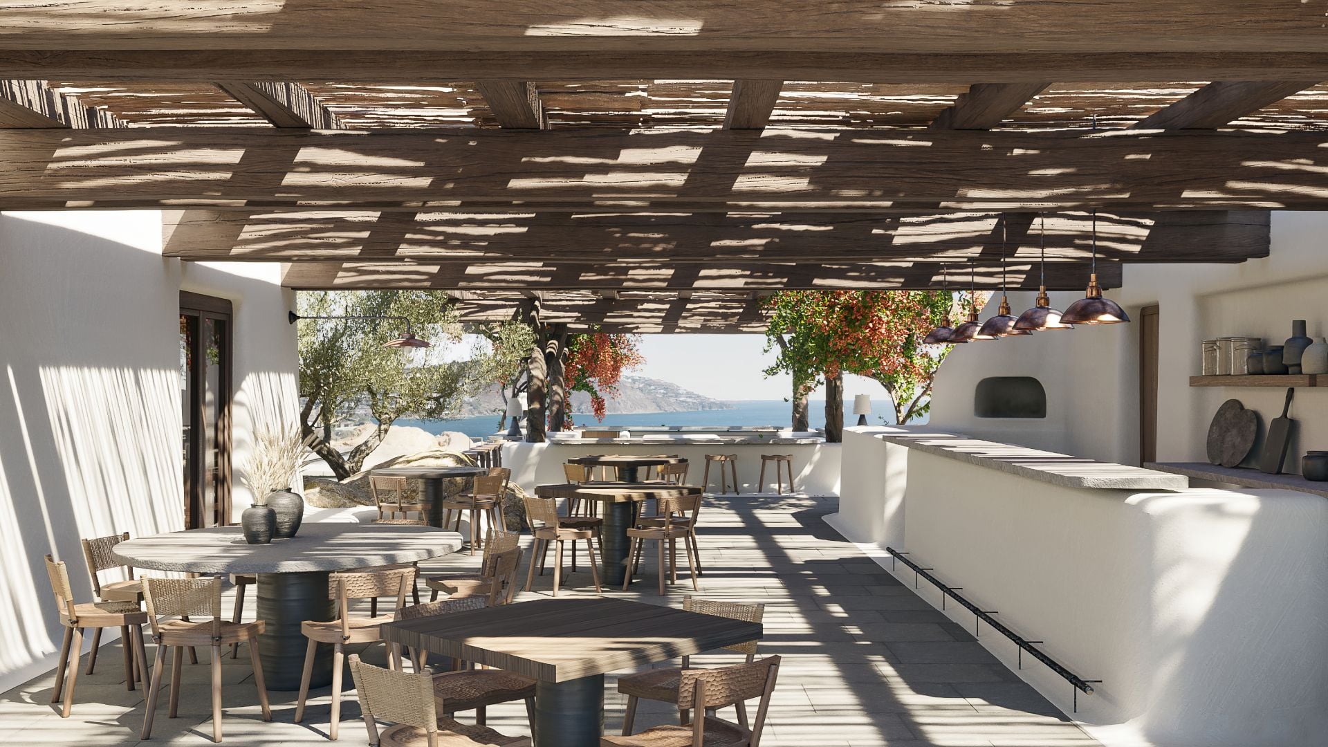 Pere Ubu, Europe — Whitewashed terrace with timber pergola, sea views, hanging plants, natural wood furnishings, pendant lights, Mediterranean luxury hospitality design.