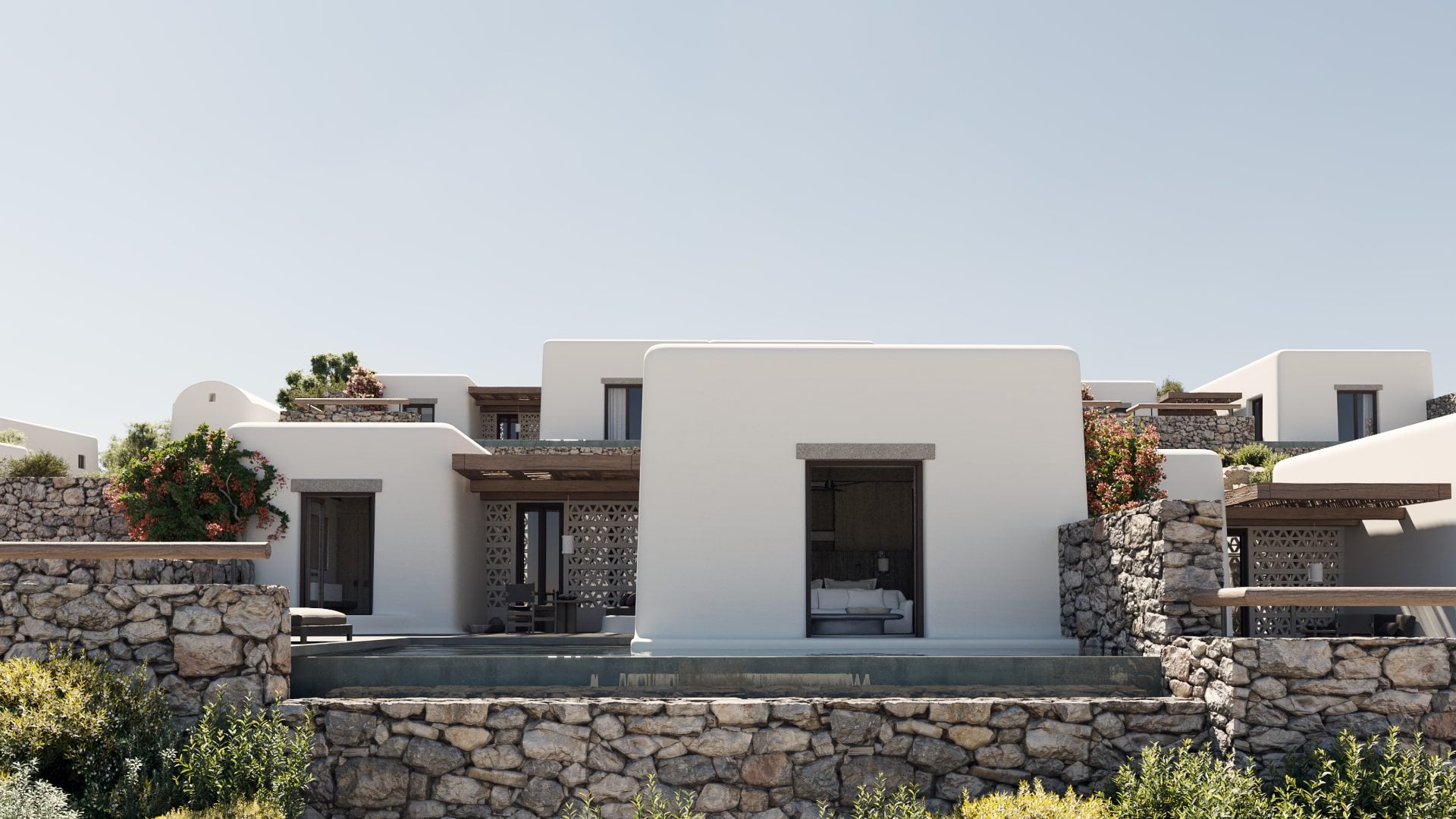 Kalesma, Europe — Minimalist whitewashed villa with stone walls, geometric screens, and infinity pool reflecting Mediterranean light and landscape.