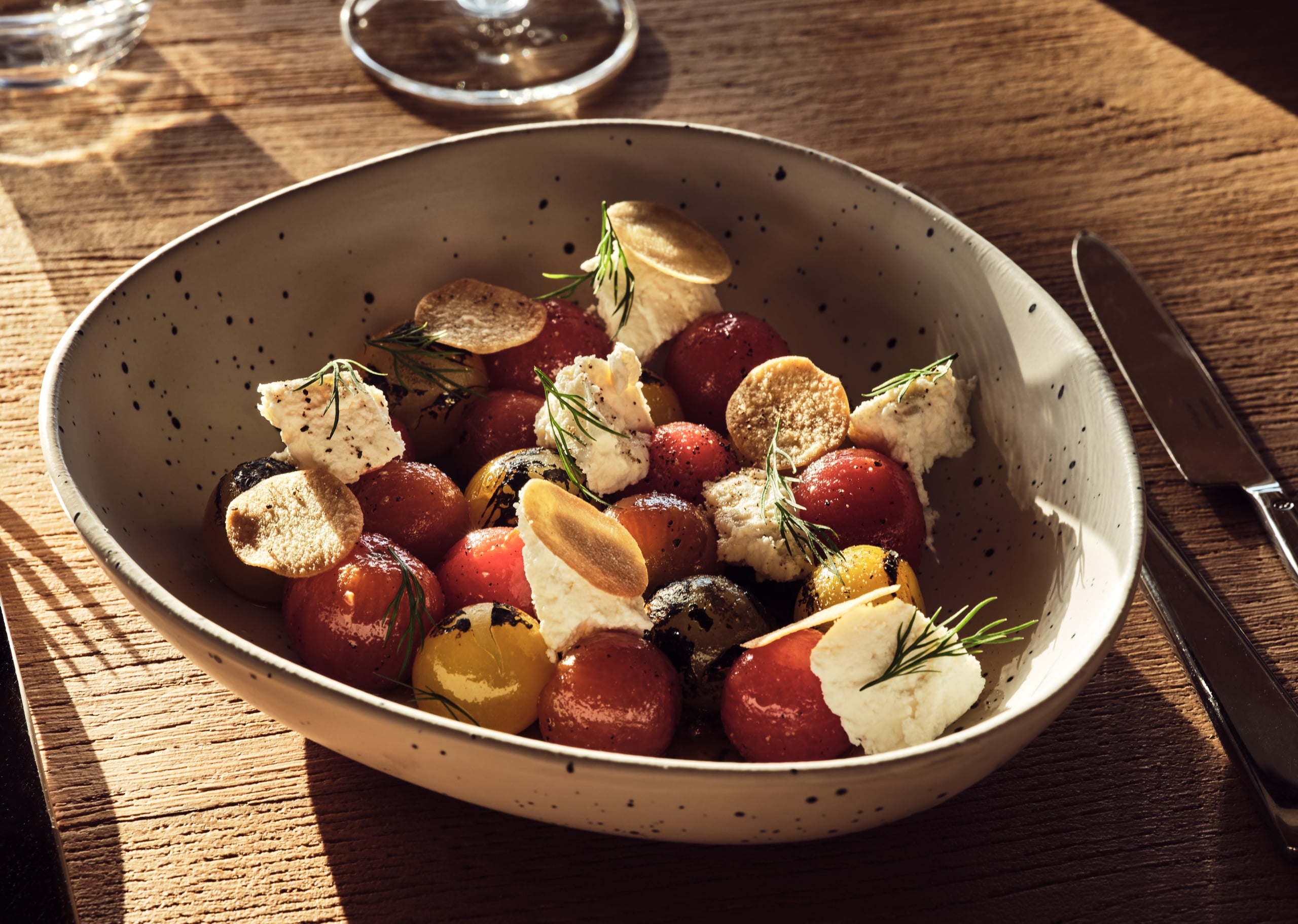 Olea All Suite Hotel, Europe — Roasted beets and whipped cheese with rosemary in speckled ceramic bowl, natural light on wooden table.