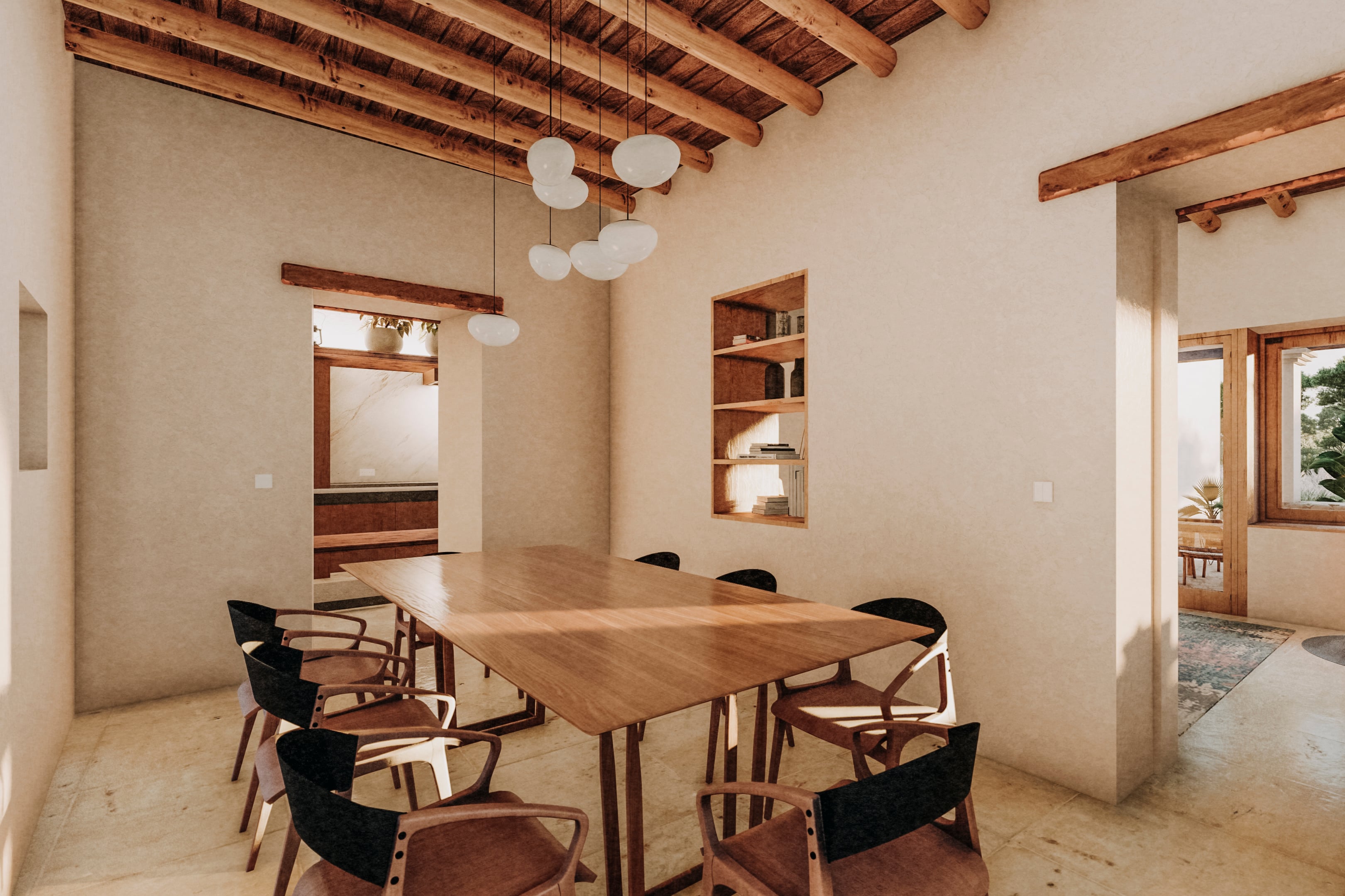 Casa Buscastell, Balearic Islands, Spain — Dining room with walnut table, black chairs, exposed timber beams, white pendant lights, and natural limestone flooring.