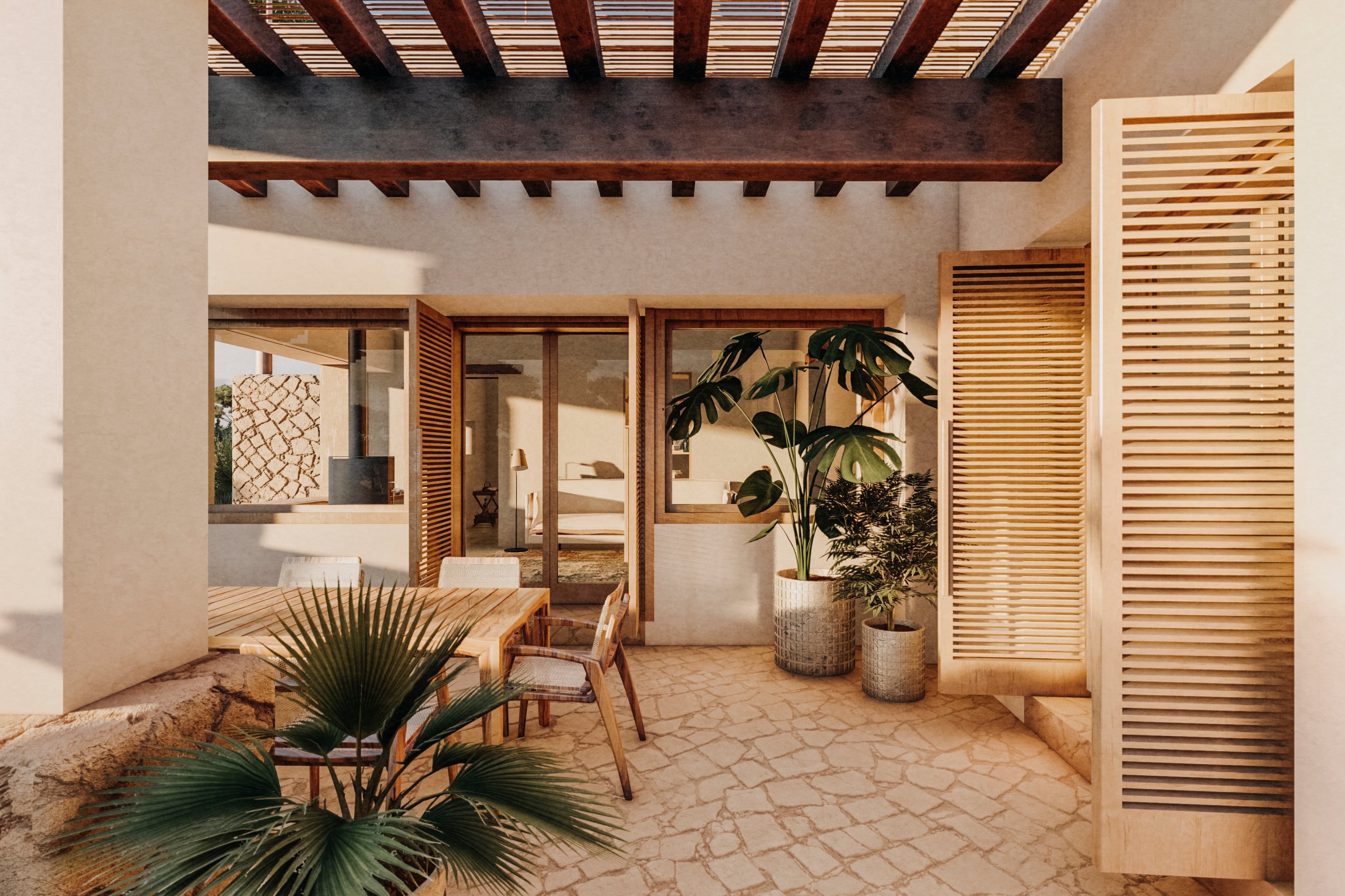 Casa Buscastell, Balearic Islands, Spain — Courtyard with exposed wooden beams, louvered screens, potted plants, and terracotta paving in warm Mediterranean light.