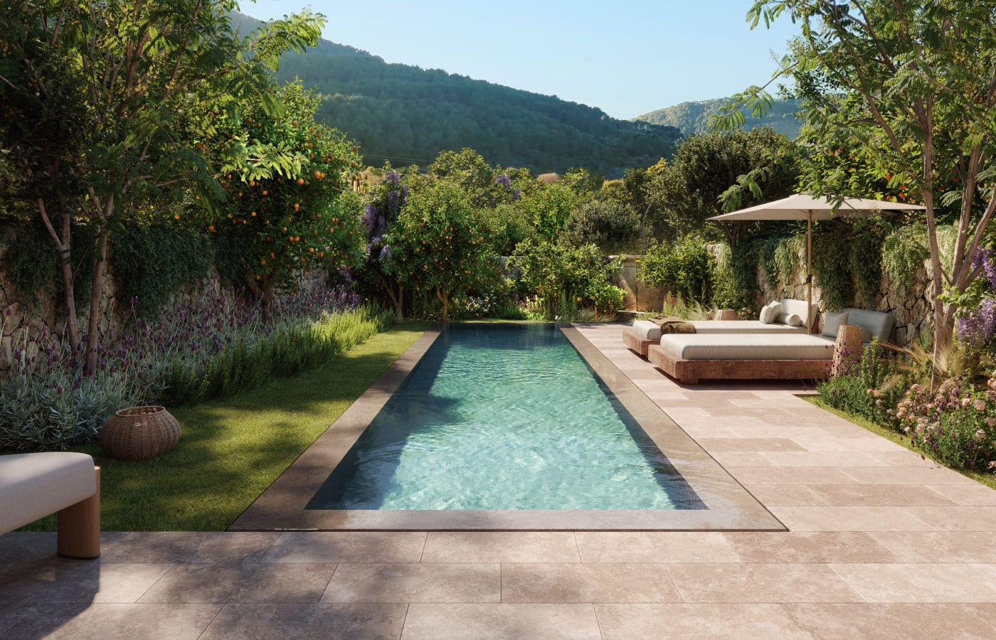 Casa Marés, Balearic Islands — Lap pool lined with lavender and climbing vines, limestone terrace, woven loungers, forested mountains beyond.