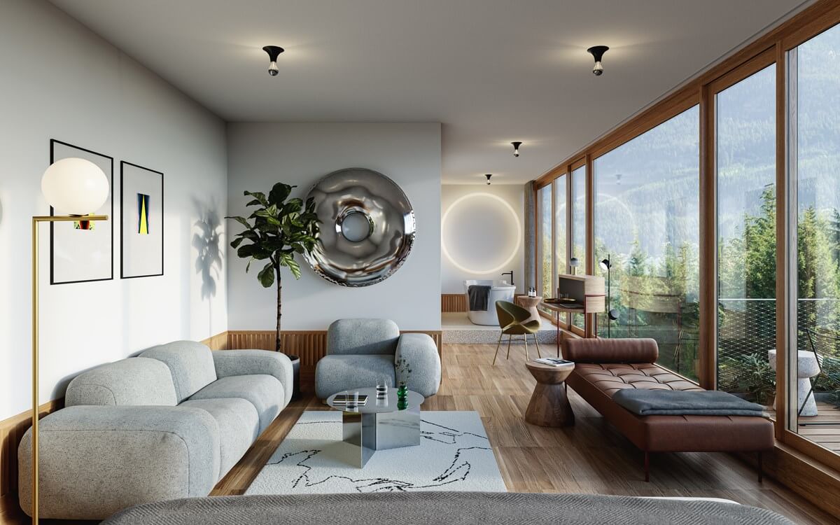 The Cōmodo — Cōmodo, Europe — Modern luxury suite with curved gray sofa, floor-to-ceiling windows overlooking forest, warm wood accents, sculptural wall art, and minimalist furnishings.