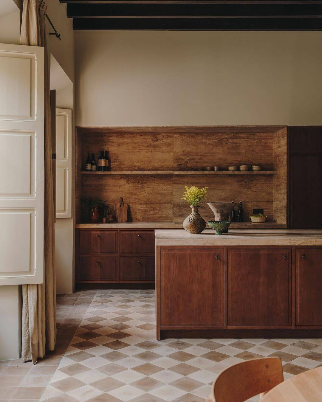 Santa Teresa 34, Balearic Islands, Spain — Warm wood cabinetry and open shelving with geometric tile flooring in minimalist hospitality kitchen design.