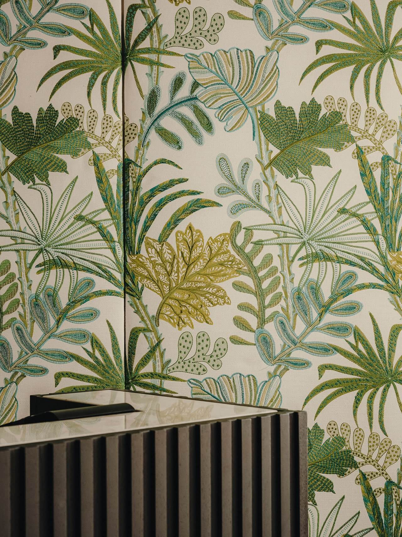 The Standard Ibiza, Balearic Islands, Spain — Botanical wallpaper with palm fronds and cacti in green and gold tones beside ribbed black architectural detail.